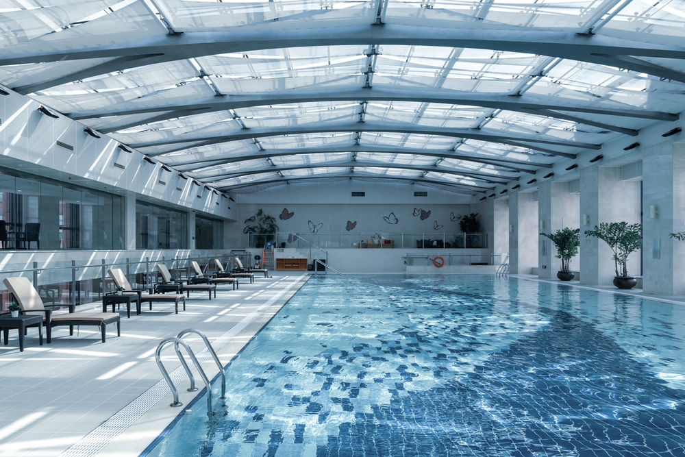 Indoor commercial swimming pool with lap lanes designed for public-use aquatic facilities